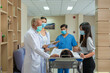 © godji10 - Team of emergency medical, doctor diagnosis patient at hospital