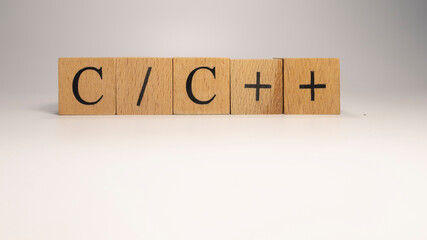 The C plus code chain is built from wooden cubes. Industry and technology. c