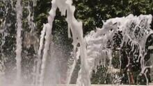 Slow Motion Shot Of Water Fountain In A Park