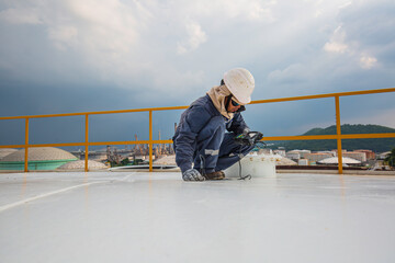 Poster - Male worker are for inspection  ultrasonic thickness roof plate top