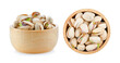 Pistachio in wood bolw on a white background