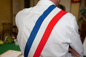 Wall Mural - back man view of french mayor of the city during an official celebration in france town hall