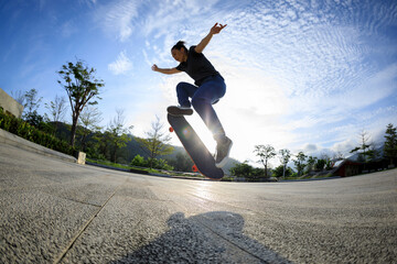 Wall Mural - Skateboarder skateboarding outdoors in city