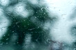 Rain waters on glass of car unique blurry photo, traveling under rain. Abstract wet windshield on rainy days during the storm photo shot from inside car. Dangerous vehicle driving and slippery road