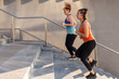 © MandriaPix - two young female runners climbing a staircase, urban training in the morning, cardio fitness and healthy lifestyle, active women