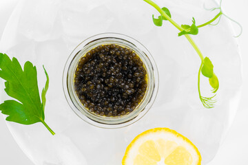 Wall Mural - Appetizers of natural sturgeon black caviar, lemon and parsley