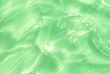Green Water Aloe Vera Gel Smudged Texture. Abstract Clear Cosmetic Cream, Face Serum, Moisturizer Background