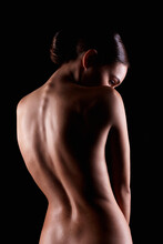 Female Silhouette. Naked Woman. Sensual Girl In Dark. Beautiful Back