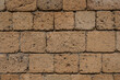 Wall made with many tuff bricks. Wall of tuff stone.