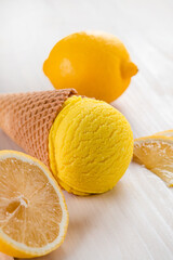 Canvas Print - lemon ice cream with lemon in a cone on a white background