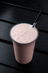 Canvas Print - Plastic glass of tasty strawberry milkshake take away