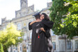 © zinkevych - Friends hugging each other after graduation and feeling happy