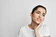 © SHOTPRIME STUDIO - woman in white t-shirt holding face pain in teeth health problems treatment