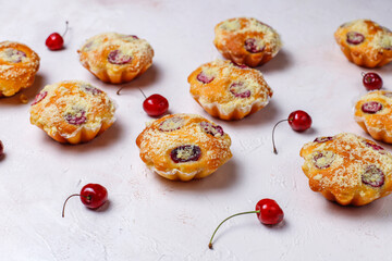 Wall Mural - Homemade muffins with sweet red cherries.