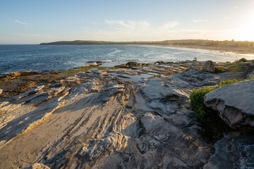 Wall Mural - Sunset over the beach with blue sky and clouds