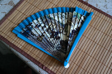 Top View Of A Blue Fan On The Table