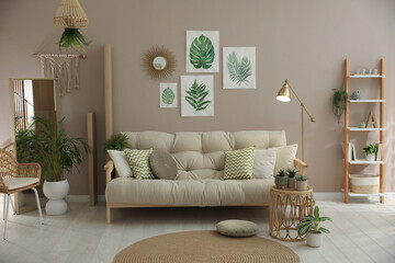 Wall Mural - Stylish living room interior with comfortable sofa and beautiful pictures on wall