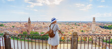 Woman Enjoying Beautiful View On Verona City In Italy On The Sunset. Verona Is Famous City Of Love In The North Of Italy.