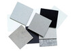 © WONGSAKORN - stack of white, grey, black of artificial stone samples isolated on white background with clipping path. Set of different quartz surface material for furnishing in interior architecture works.