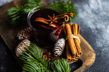 Glass Of Mulled Wine With Spices On Concrete Background
