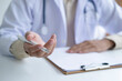 © Cavan Images - Doctor consulting with patient at office room.