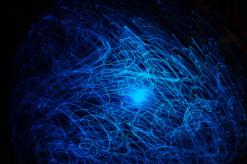 Wall Mural - blue abstract particles and lines with bokeh and blur in dark background.