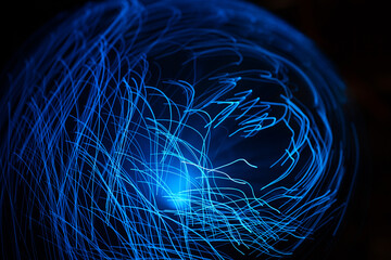 Wall Mural - blue abstract particles and lines with bokeh and blur in dark background.