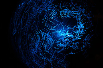 Wall Mural - blue abstract particles and lines with bokeh and blur in dark background.