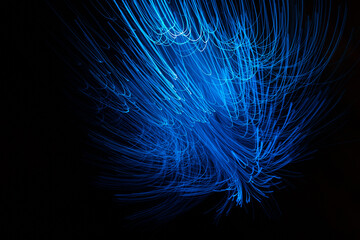 Wall Mural - blue abstract particles and lines with bokeh and blur in dark background.