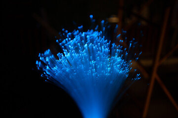 Wall Mural - blue abstract particles and lines with bokeh and blur in dark background.