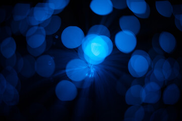 Wall Mural - blue abstract particles and lines with bokeh and blur in dark background.