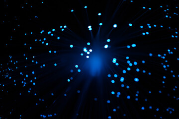Wall Mural - blue abstract particles and lines with bokeh and blur in dark background.