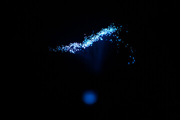 Wall Mural - blue abstract particles and lines with bokeh and blur in dark background.