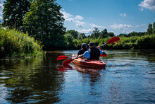People Kayaking On The Narew River In Podlasie, Father And Son, Joint Activity, Two People, Group Rafting