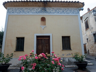 Wall Mural - ancient church facade with frescoes in  a small village in the French Riviera back country