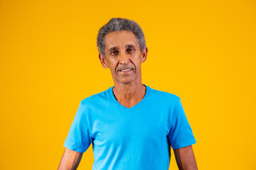 Afro elderly man smiling looking at camera with space for text