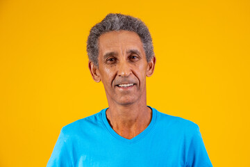 Afro elderly man smiling looking at camera with space for text