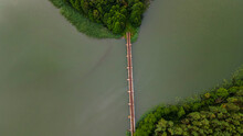 Iron Steel Frame Construction Of Narrow Gauge Railway Bridge Across The River Or Lake. Bridge With The Narrow Gauge Railway. Aerial View. Space For Text.