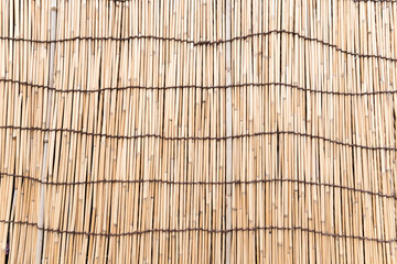  Bamboo wall with brown rope