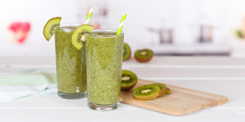 Wall Mural - Green smoothie fruit juice kiwi drink in a glass panorama with copyspace copy space