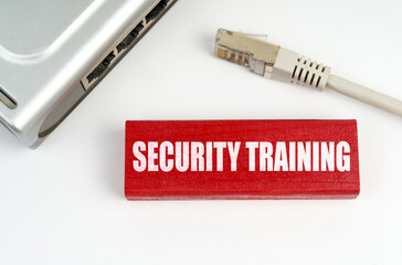 Poster - There is a router on the table, disconnected from the network, next to a plaque with the inscription - Security Training