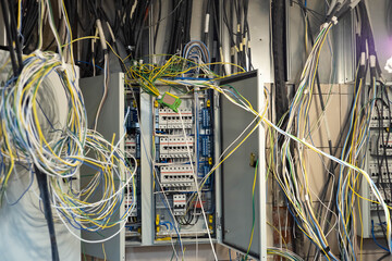 Poster - tangled wires in electrical cabinet. electric and mains wires are tangled. concept - adjustment of p