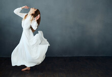 Cheerful Pretty Woman In White Dress Elegant Style Dance Performance