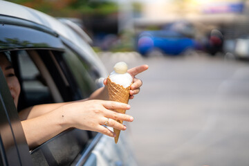 Sticker - Thai woman holding ice cream through a car window