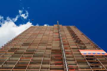 Wall Mural - Scaffolding in front of a facade of a high-rise building