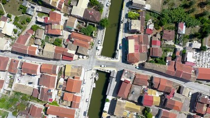 Wall Mural - Channel with bridge in Lefkimmi town on the island of Corfu, Ionian Islands, Greece, 4k drone footage