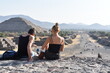 foreign couple resting while admiring the archaeological zone of Teotihuacán