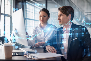 Wall Mural - Businessman and businesswoman in formal wear working together to optimize trading strategy at corporate finance fund. Forex chart hologram over office background with panoramic windows