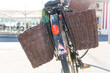 bicycle with rear wicker pannier baskets in the street