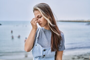 Sticker - Young caucasian woman outdoors tired rubbing nose and eyes feeling fatigue and headache. stress and frustration concept.